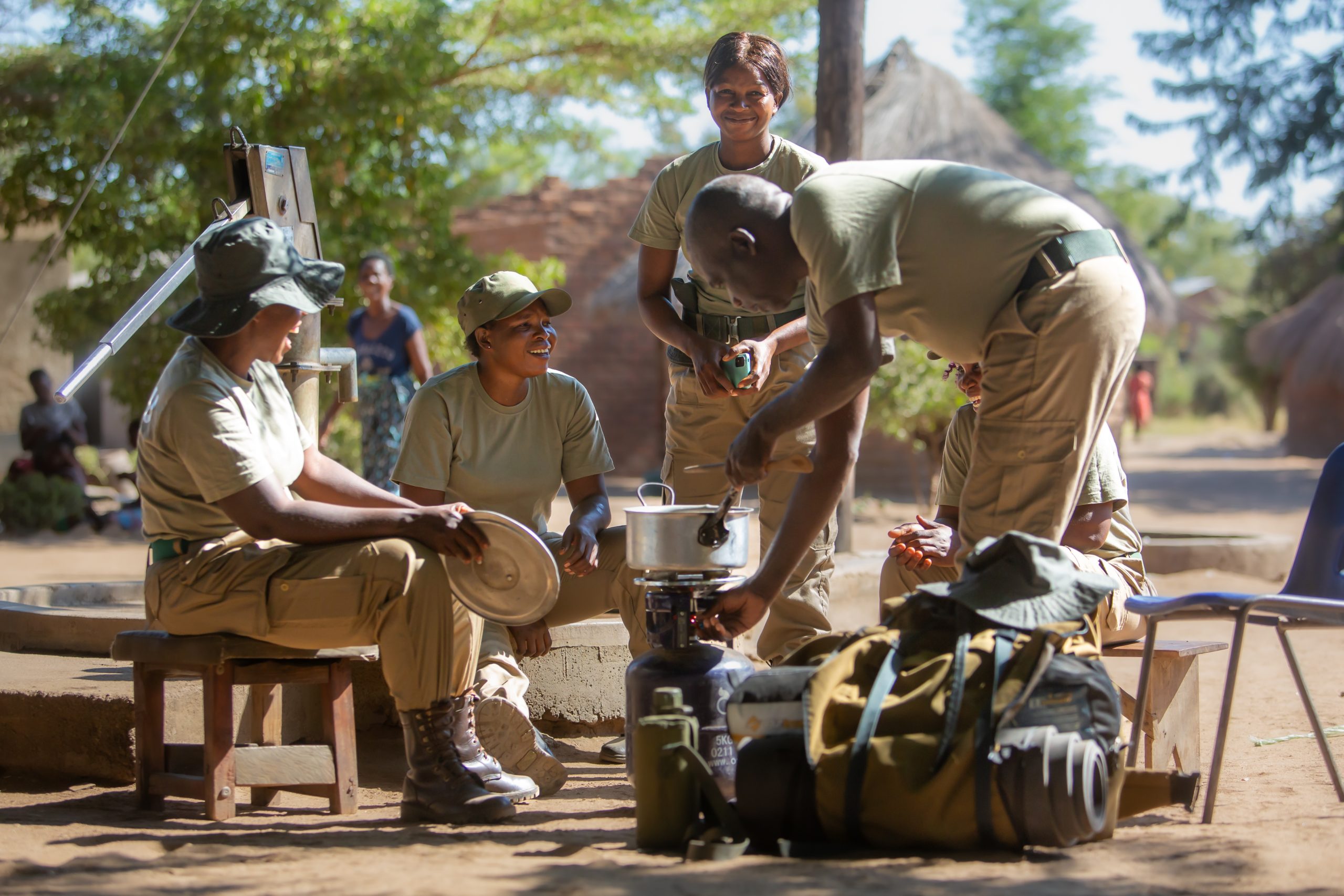 Catherine (seated on the left wearing hat) and Christine (standing) with their colleagues from the CSL Rapid Response Unit © Courtesy of Conservation South Luangwa