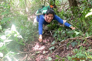 Francy Forero climbing in the forest